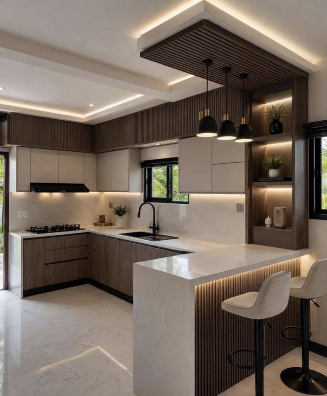 Two-tone kitchen remodel with dark lower cabinets, white quartz waterfall island, a lit wood shelving tower and a tray ceiling